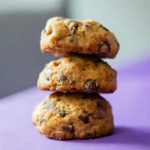 Stack of three delicious chocolate chip cookies.