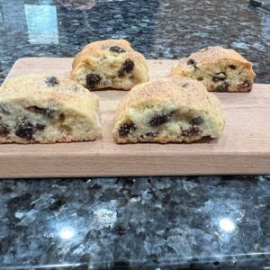 A picture of Choco chip cookies on the wooden tray